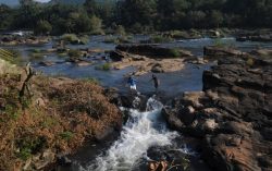 Crossing the River at Thumburmoozhi at Kerala