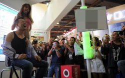 Crazy World: Model feeds guy milk straight from her mouth at Guangzhou Sex Culture Festival