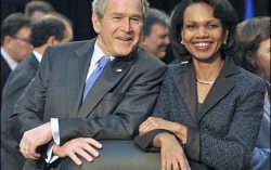 George W. Bush is chatting with Condoleeza Rice