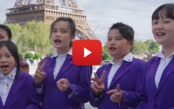 Children from Wuzhishan, Hainan Sings on the Seine in Paris during the opening performance of the Sino-French Gourmet Carnival