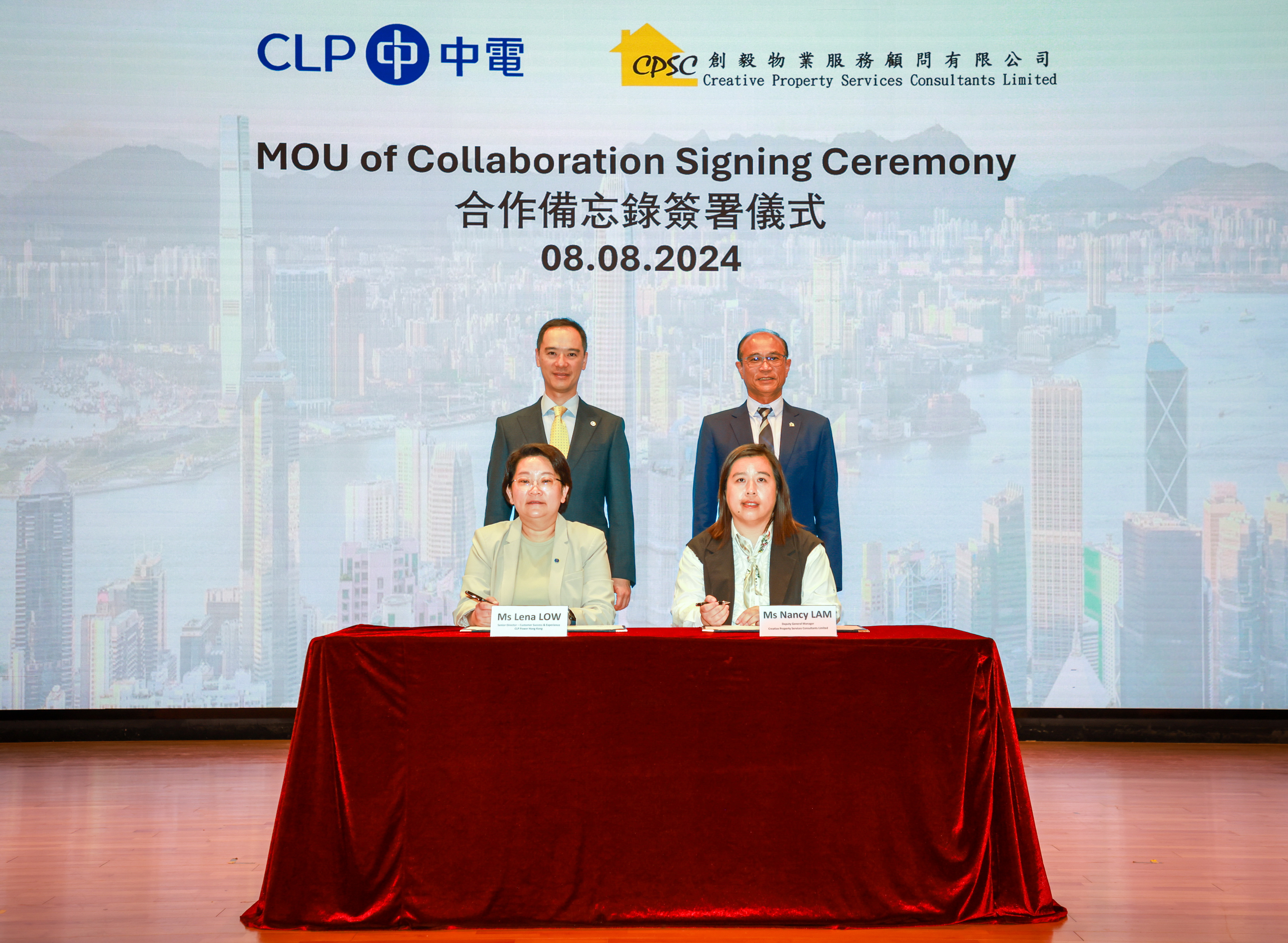 CLP Power Senior Director of Customer Success and Experience Ms Lena Low (left, front row) and Creative Property Deputy General Manager Ms Nancy Lam (right, front row) sign a Memorandum of Understanding to work together to enhance Creative Property’s resilience against extreme weather conditions and to promote energy saving, decarbonisation, digitisation, and community support, drawing on their combined strengths to combat climate change. CLP Power Managing Director Mr Joseph Law (left, back row) and Creative Property Director and General Manager Mr Stephen Poon (right, back row) witness the signing ceremony.