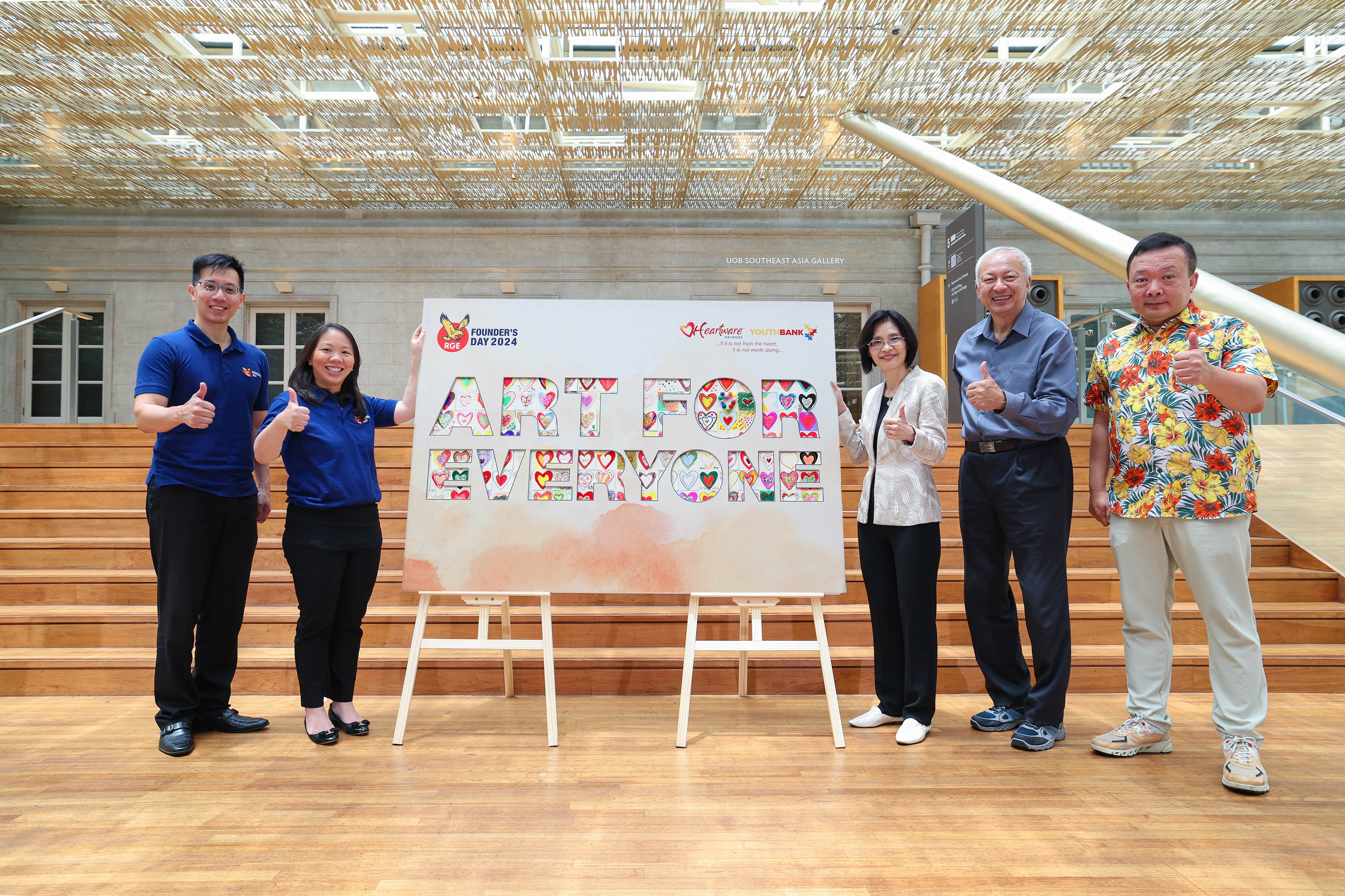 Celebrating inclusivity and community through art, the 'ART FOR EVERYONE' display was created at RGE Founder’s Day 2024; on stage were (from left to right) Mr. Benny Lee (Executive Vice President of External Affairs, RGE), Ms. Imelda Tanoto (Managing Director and a member of the Executive Committee at RGE), Ms. Chang Hwee Nee (Chief Executive of the National Heritage Board and Chairman of Stroke Support Station), Dr. Ting Seng Kiong (Chairman of Heartware Network), and Mr. Raymond Huang (Board Member of Heartware Network)