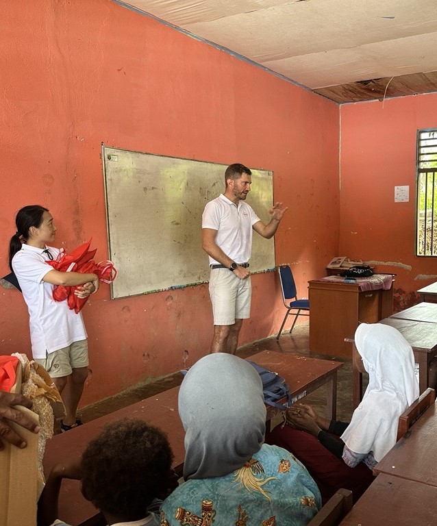 Alejandro Schoenhoff, President of Henkel Indonesia, greeting students and teachers at SD Namatota.