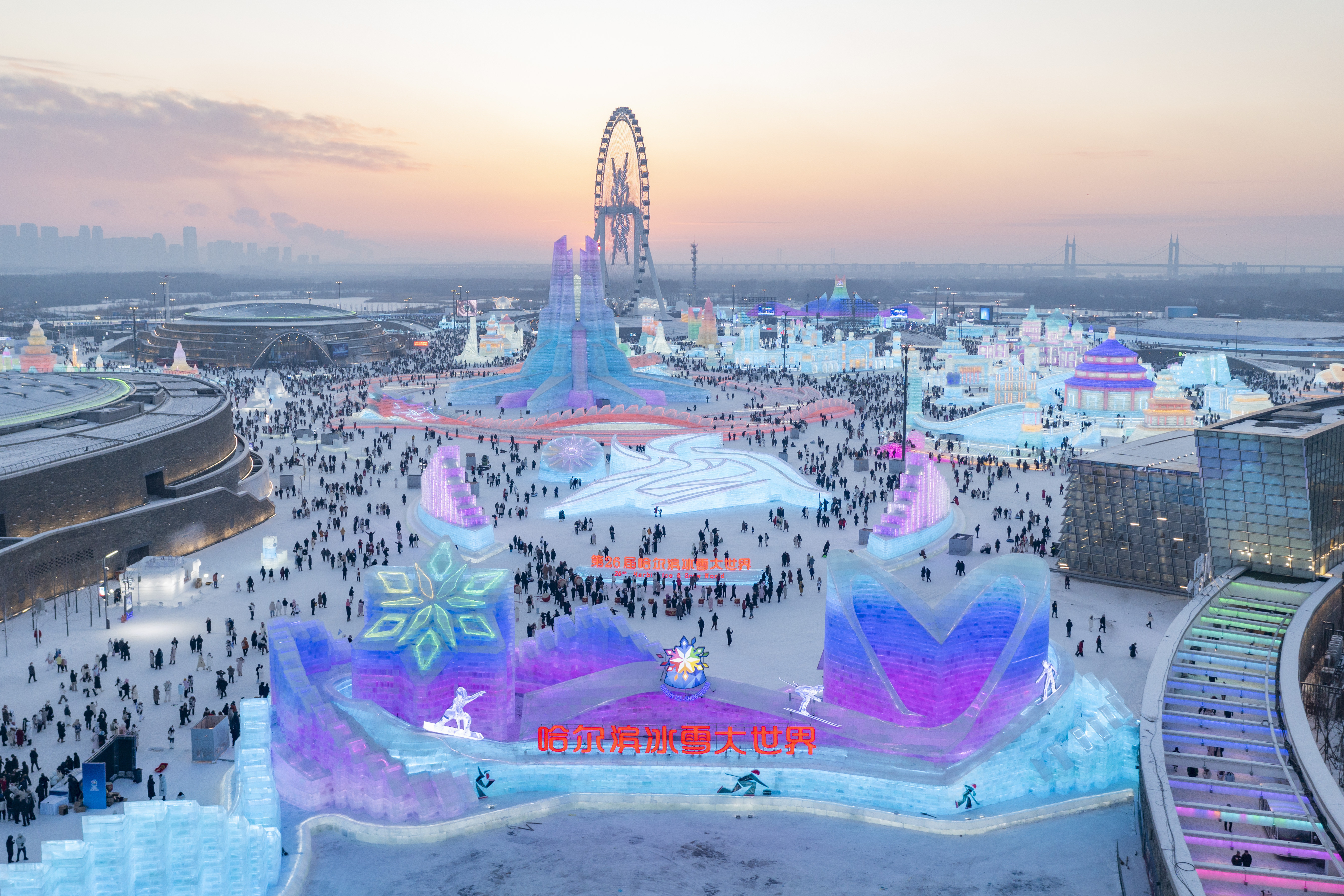 An aerial drone photo shows a view of the Harbin Ice-Snow World in Harbin, northeast China's Heilongjiang Province, Dec. 21, 2024. (Xinhua/Xie Jianfei)