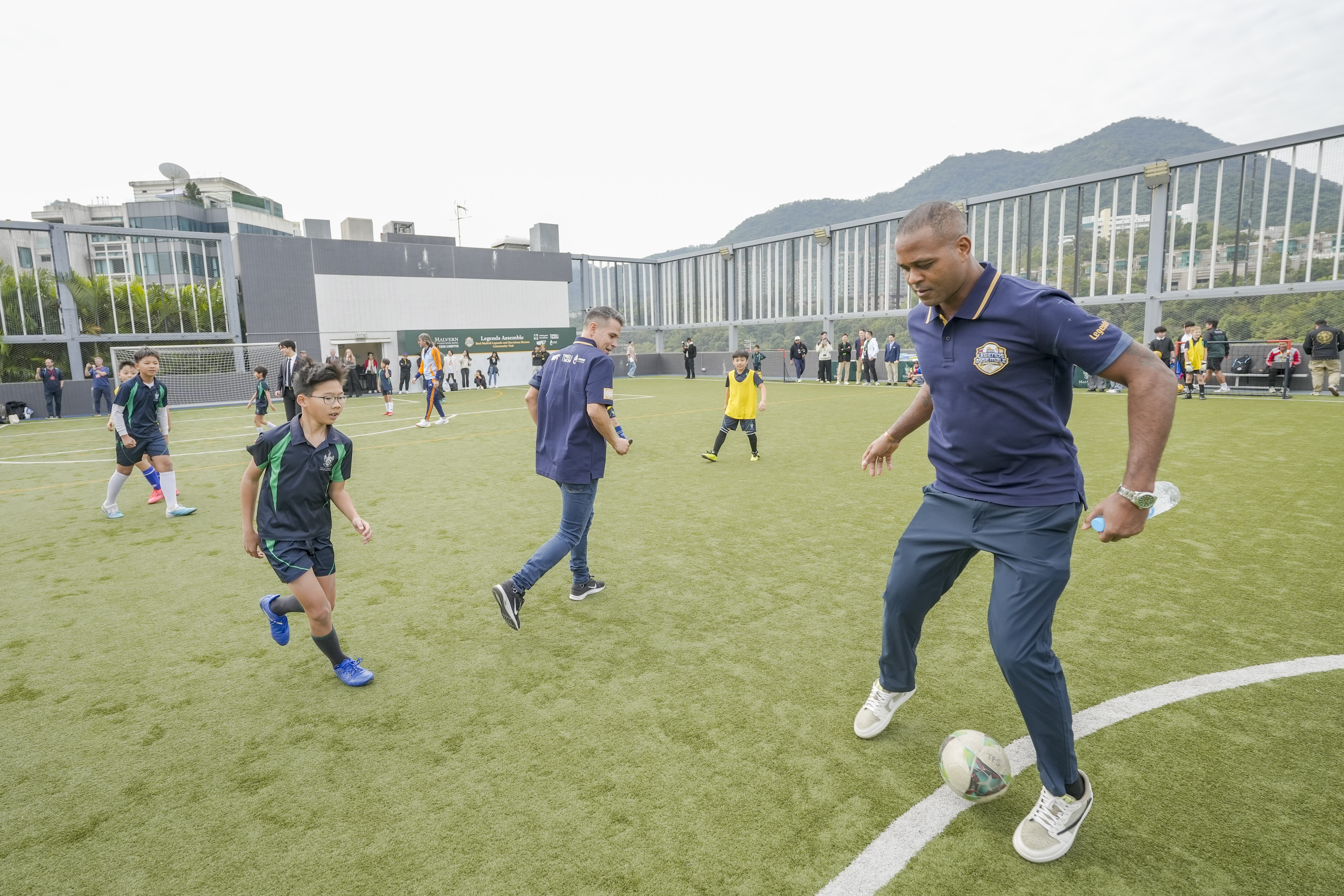 Legends unite L-R: Malvern College Hong Kong pupils with Javier Saviola and Patrick Kluivert.